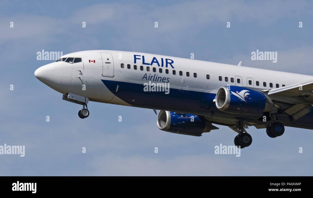 Abbotsford, British Columbia, Canada. 17th July, 2018. A Flair Airlines Boeing 737-400 (C-FLRS) single-aisle narrow-body jet airliner on final approach for landing. The airline has started ultra-low-cost sevice in Canada and is headquartered in Edmonton, Alberta. Credit: Bayne Stanley/ZUMA Wire/Alamy Live News Stock Photo