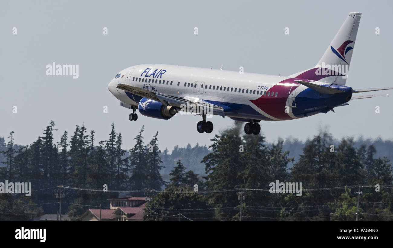 Abbotsford, British Columbia, Canada. 17th July, 2018. A Flair Airlines Boeing 737-400 (C-FLRS) single-aisle narrow-body jet airliner lands at Abbotsford International Airport. The airline has started ultra-low-cost sevice in Canada and is headquartered in Edmonton, Alberta. Credit: Bayne Stanley/ZUMA Wire/Alamy Live News Stock Photo