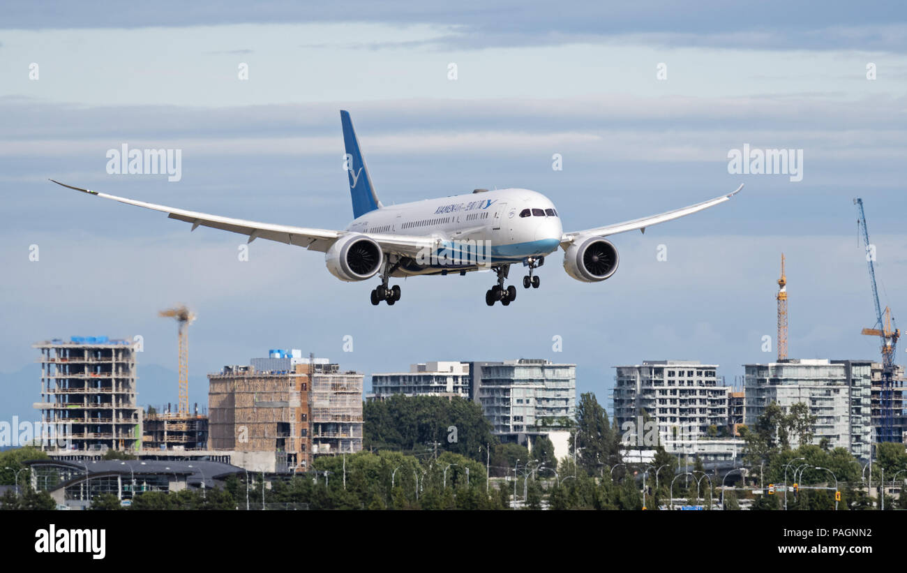 Richmond, British Columbia, Canada. 2nd July, 2018. A XiamenAir (Xiamen Airlines) Boeing 787-8 Dreamliner (B-2762) wide-body jet airliner airborne on final approach for landing at Vancouver International Airport, passes by new high-rise condominium construction in Richmond, British Columbia, Canada. Credit: Bayne Stanley/ZUMA Wire/Alamy Live News Stock Photo