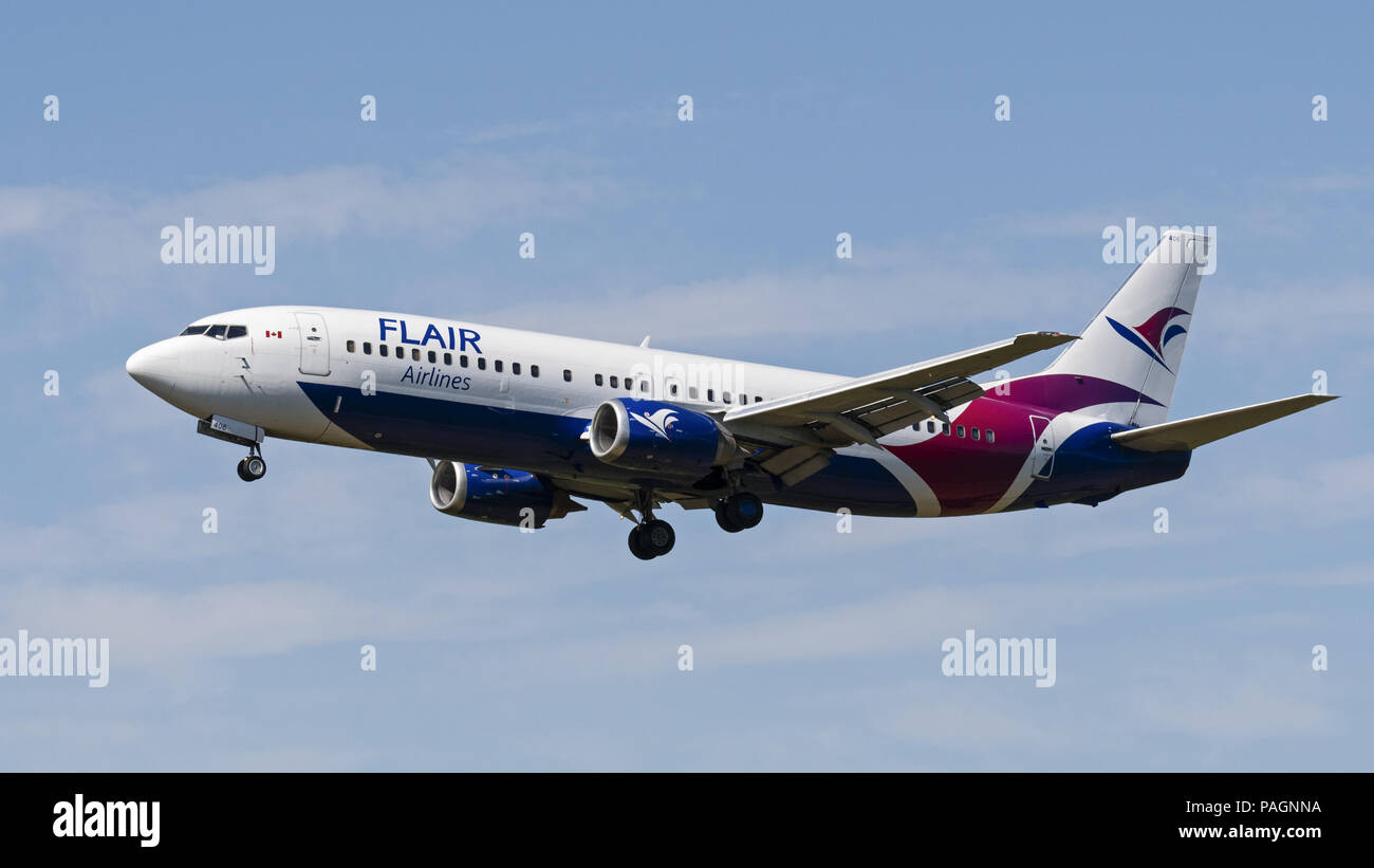 Abbotsford, British Columbia, Canada. 17th July, 2018. A Flair Airlines Boeing 737-400 (C-FLRS) single-aisle narrow-body jet airliner on final approach for landing. The airline has started ultra-low-cost sevice in Canada and is headquartered in Edmonton, Alberta. Credit: Bayne Stanley/ZUMA Wire/Alamy Live News Stock Photo