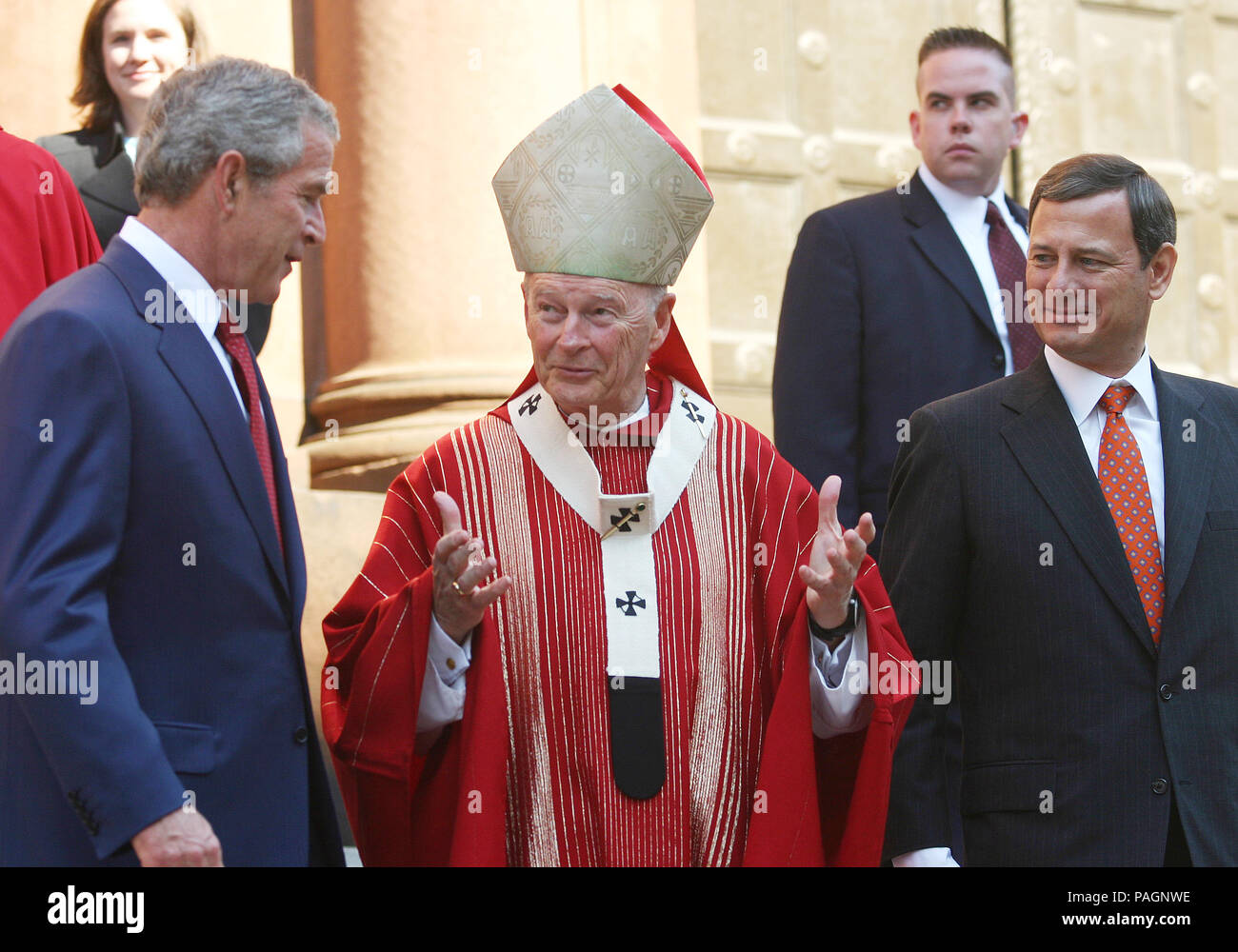 Washington, DC - October 2, 2005 - United States President George W. Bush attends 52nd Annual Red Mass at St. Matthews Cathedral. Red Mass is a tradition that is held the Sunday prior to the Supreme Court's opening session. The service gives special prayers for the court and the judges as they start hearing this session's cases. This mass is special in that the new Chief Justice, John G. Roberts, Jr. was in attendance along with his wife Jane. First lady Laura Bush was in attendance as well as United States Secretary of State Condoleezza Rice and White House Chief of Staff Andrew Card. Stock Photo