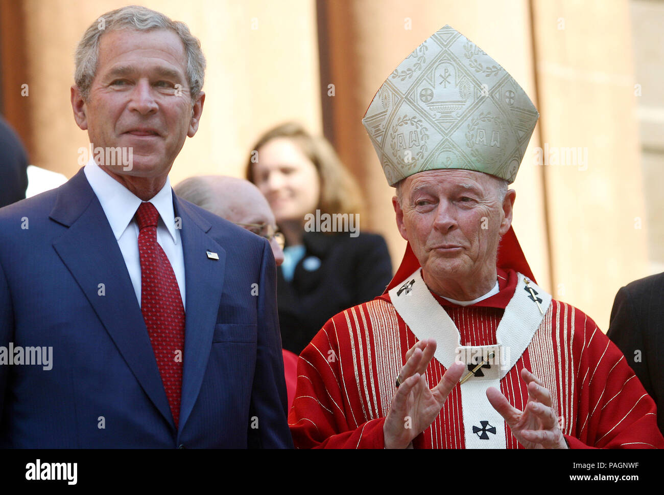 Washington, DC - October 2, 2005 - United States President George W. Bush attends 52nd Annual Red Mass at St. Matthews Cathedral. Red Mass is a tradition that is held the Sunday prior to the Supreme Court's opening session. The service gives special prayers for the court and the judges as they start hearing this session's cases. This mass is special in that the new Chief Justice, John G. Roberts, Jr. was in attendance along with his wife Jane. First lady Laura Bush was in attendance as well as United States Secretary of State Condoleezza Rice and White House Chief of Staff Andrew Card. Stock Photo