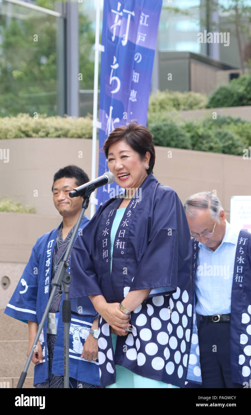 Tokyo, Japan. 23rd July, 2018. Tokyo Governor Yuriko Koike delivers a speech as she sprinkles recycle water on the ground to cool down at the Tokyo Midtown Hibiya in Tokyo on Monday, July 23, 2018. Kumagaya city near Tokyo recorded Japan's highest temperature of 41.1 degrees Celsius and more than 40 people died for heatstroke as the heat wave attacked across Japan. Credit: Yoshio Tsunoda/AFLO/Alamy Live News Stock Photo