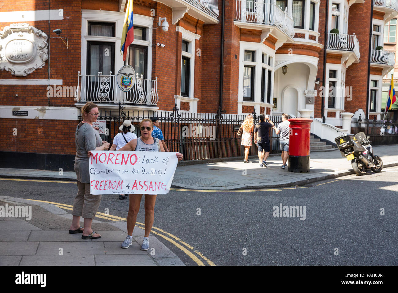 London, UK. 23rd July, 2018. Supporters of whistleblower Julian Assange, founder of Wikileaks, protest outside the Ecuadorian embassy. Ecuador’s President Lenín Moreno is in the UK to deliver the keynote speech at the 2018 Global Disability Summit and some commentators believe that he will also finalise an agreement with British officials by which Ecuador will withdraw asylum protection from Assange, evict him from the embassy and hand him over to British authorities. Credit: Mark Kerrison/Alamy Live News Stock Photo