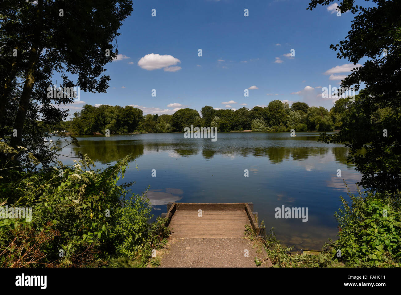 London, UK.  23 June 2018.  Reflections at Bury Lake during hot weather at Rickmansworth Aquadrome in north west London, on a day when temperatures reached 30C.  Temperatures up to 35C are forecast for the rest of the week during the current heatwave. Credit: Stephen Chung / Alamy Live News Stock Photo