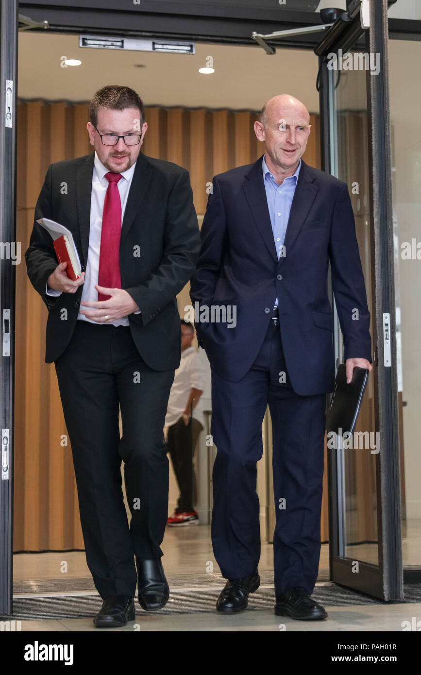 Smith Square, Westminster, London, UK, 23th July 2018. Shadow Secretary of State for Housing, John Healey (r) leaves the meeting with Andrew Gwynne, Shadow Secretary of State for Communities (l). Members of the Labour Shadow Cabinet, as well as others, exit a meeting at Transport House in Smith Square, Westminster. Members were said to discuss Antisemitism accusations against the Labour Party, as well as addressing statements made by Margaret Hodge, and whether disciplinary action would be taken against Hodge. They did not comment on the issues involved. Credit: Imageplotter News and Stock Photo