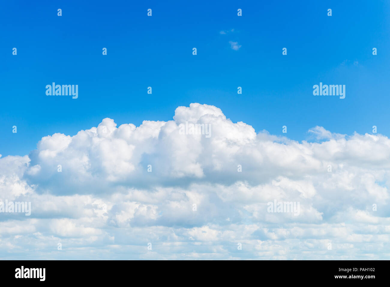 Amazing White Fluffy Clouds on Bright Blue Sky Stock Photo