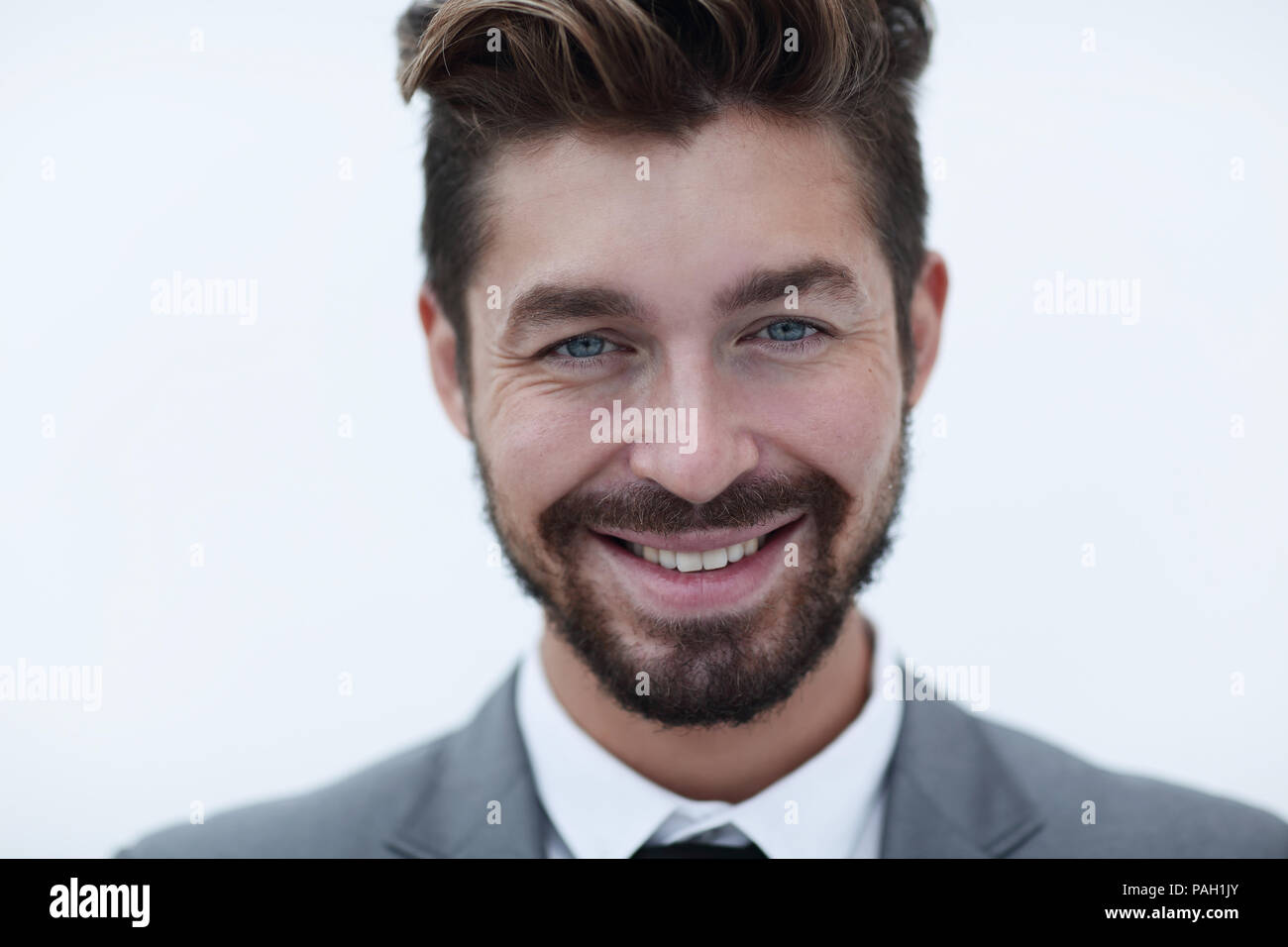 Serious businessman wearing suit and tie. blue background Stock Photo ...