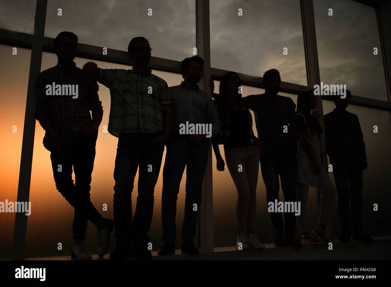 creative business team standing near the office window Stock Photo - Alamy