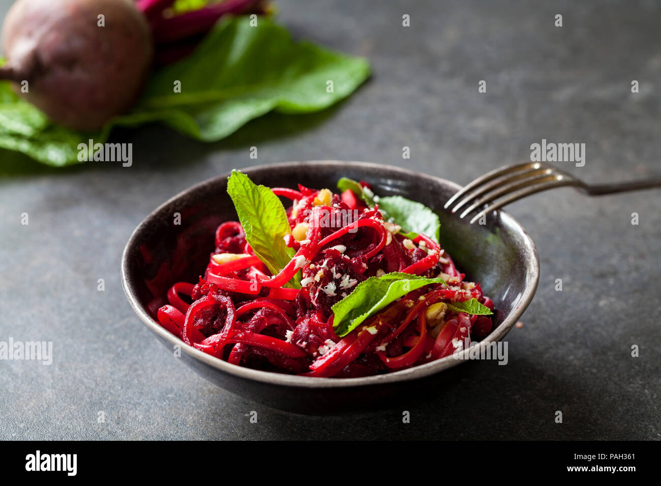 Beetroot spaghetti with hazelnuts and horseradish Stock Photo Alamy