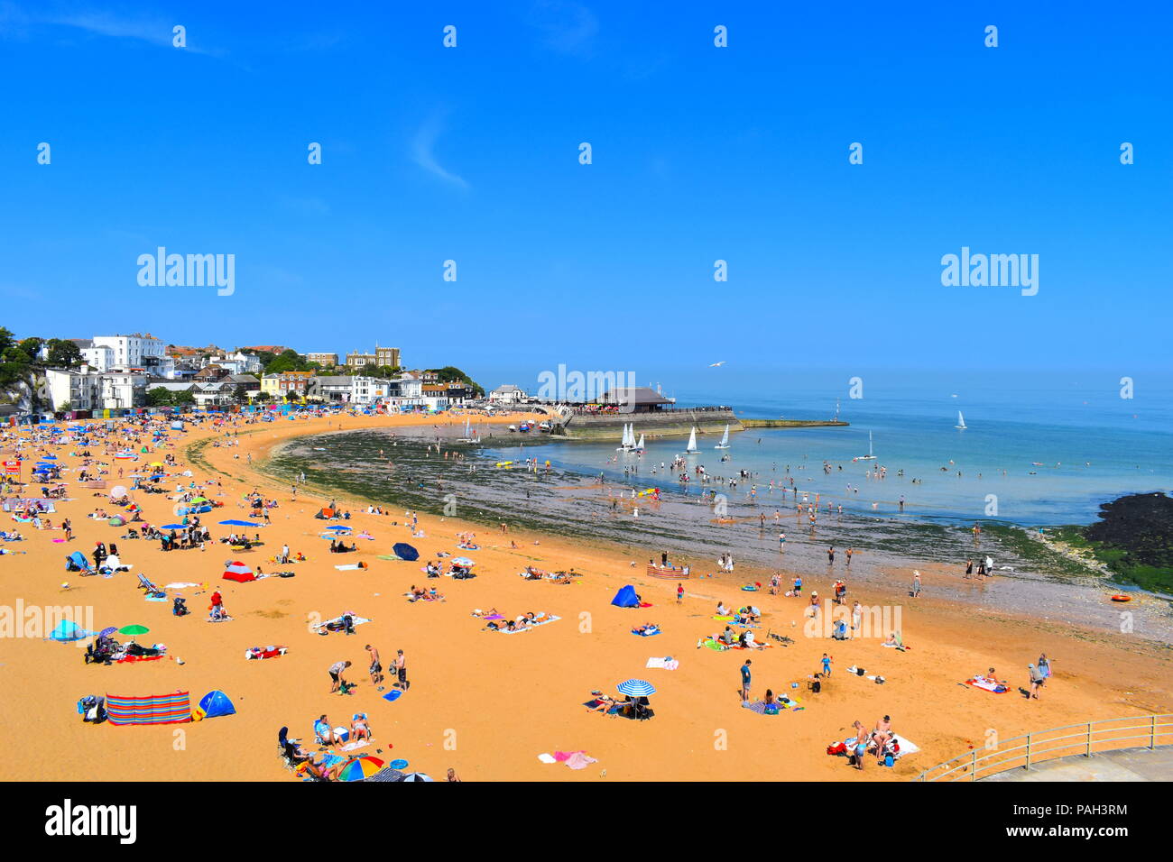 People enjoy the beach in Broastairs, Kent as the hot weather continues