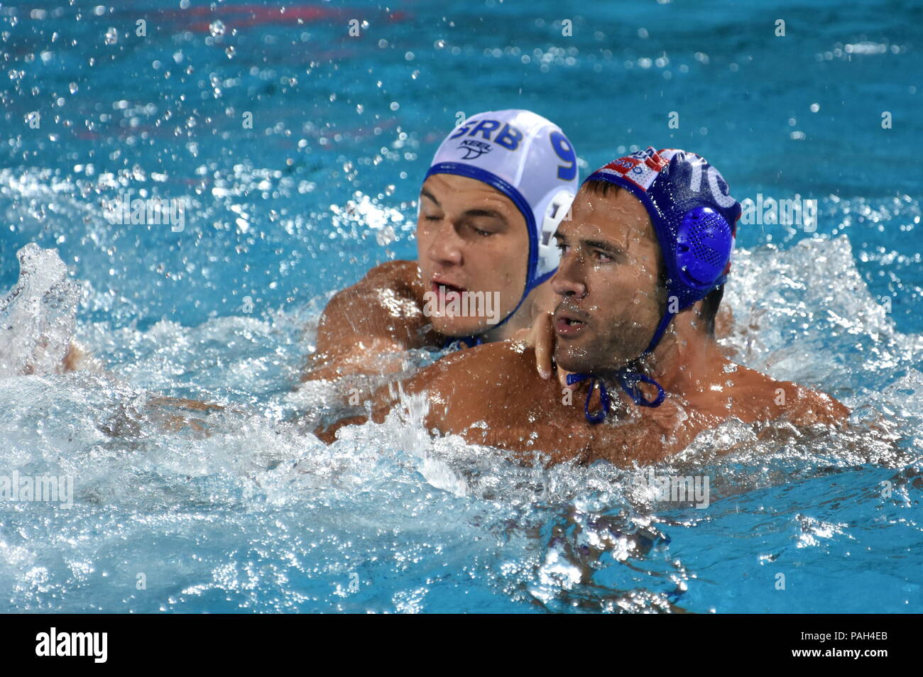 Budapest, Hungary - Jul 27, 2017. KRAPIC Ivan (CRO, cap 10) fights against JAKSIC Nikola (SRB, cap 9). FINA Waterpolo World Championship, Semifinal. Stock Photo