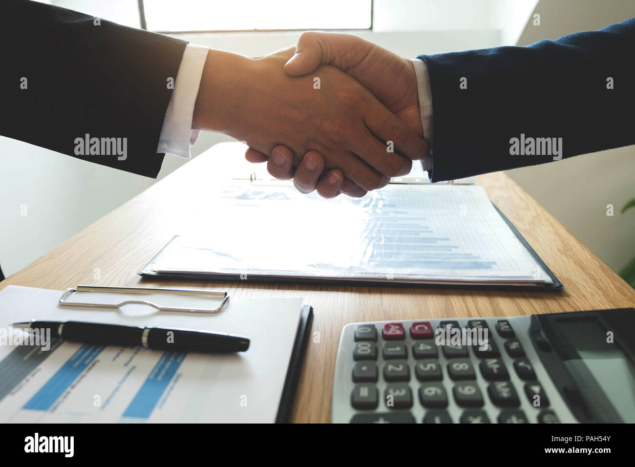 Business handshake. Business people shaking hands, finishing up a meeting,Success agreement negotiation. Stock Photo