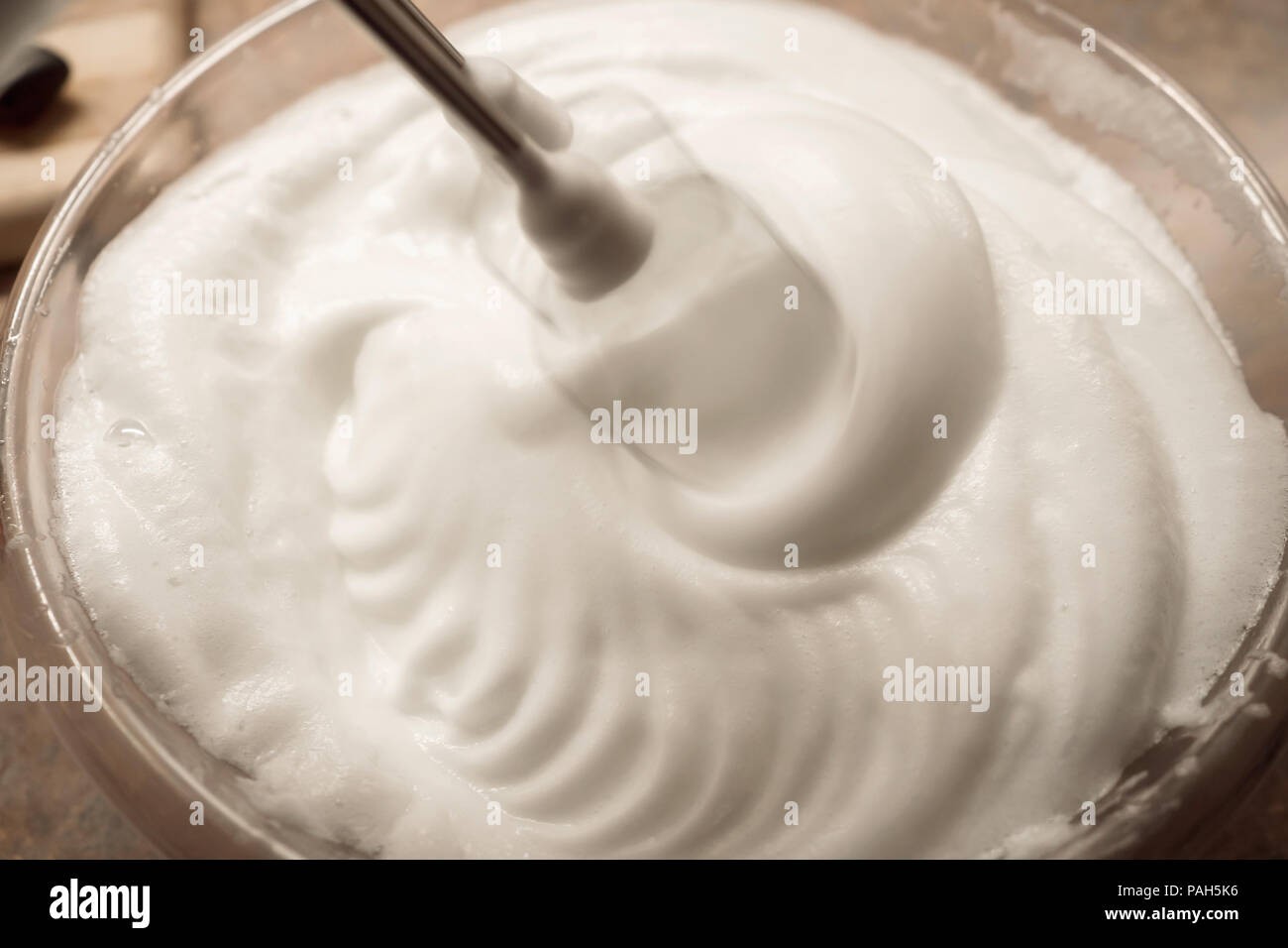 Beaten egg white with the blender Stock Photo Alamy