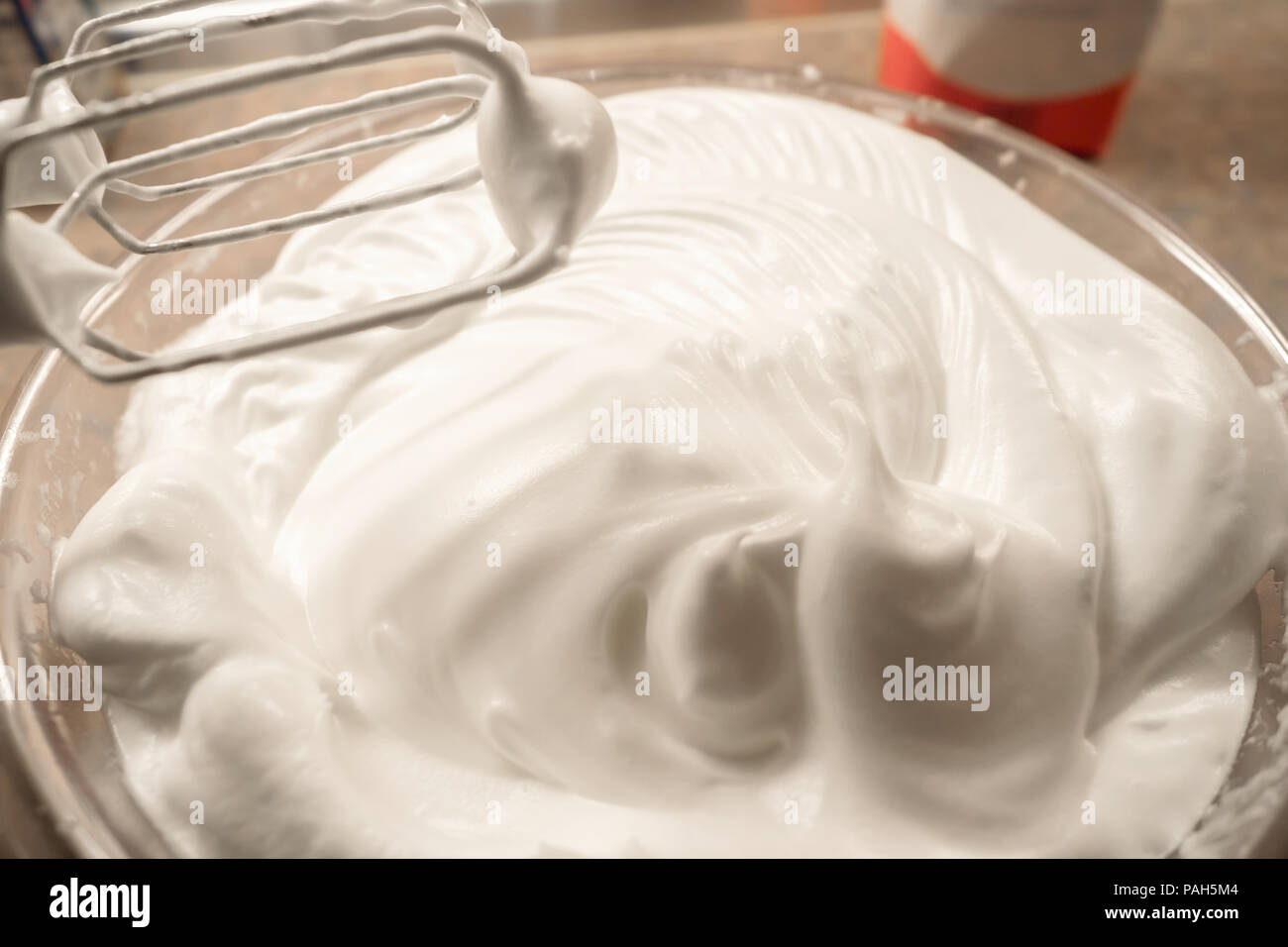 Beaten egg white with the blender Stock Photo Alamy