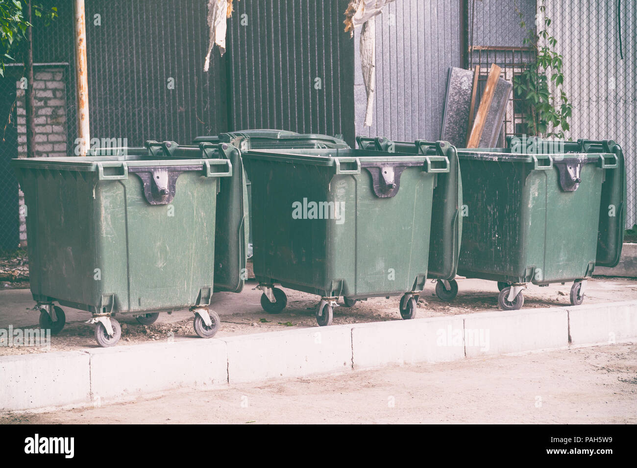 Three plastic garbage cans Stock Photo Alamy