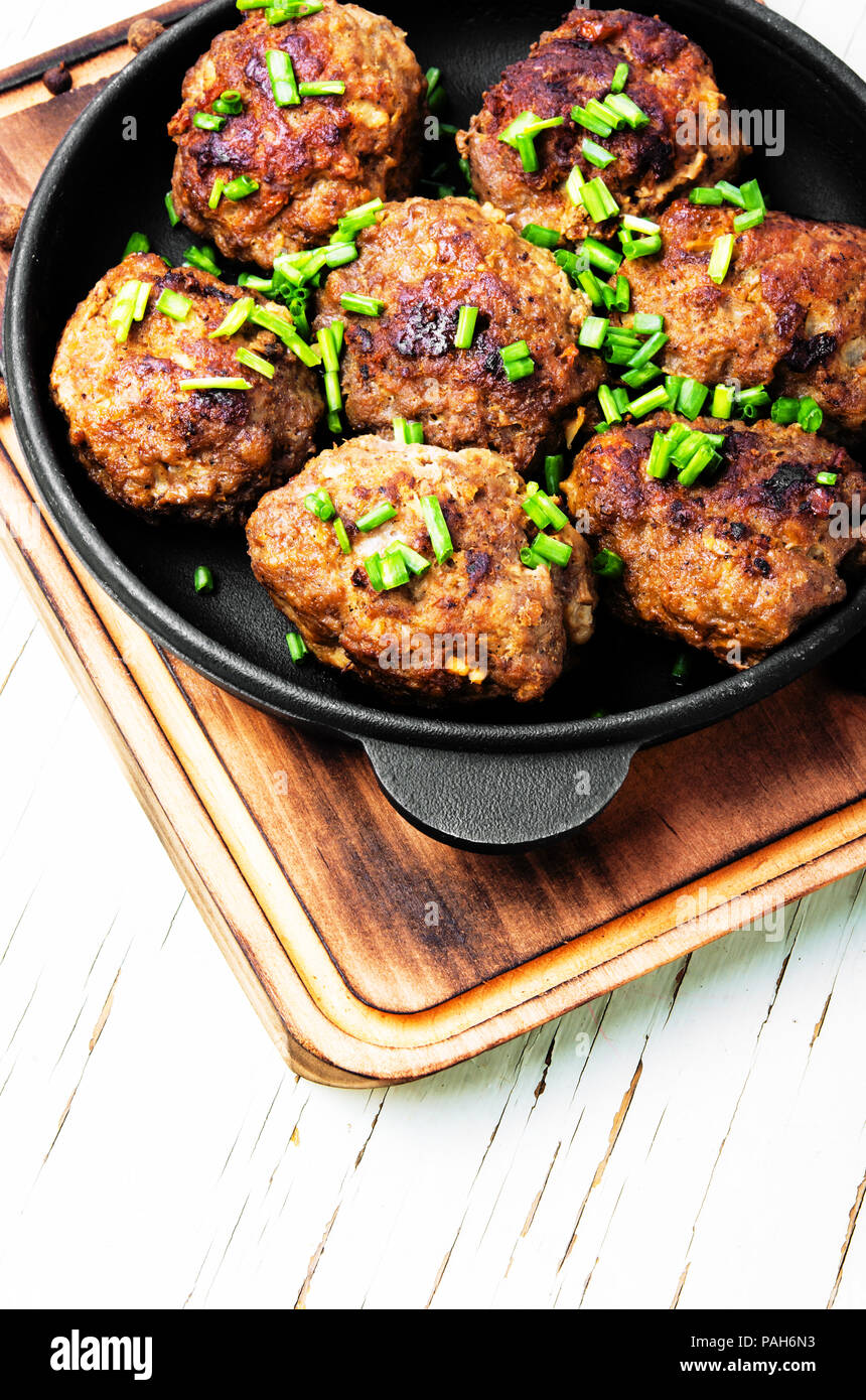 Roasted beef meatballs in castiron skillet.Delicious cutlet Stock