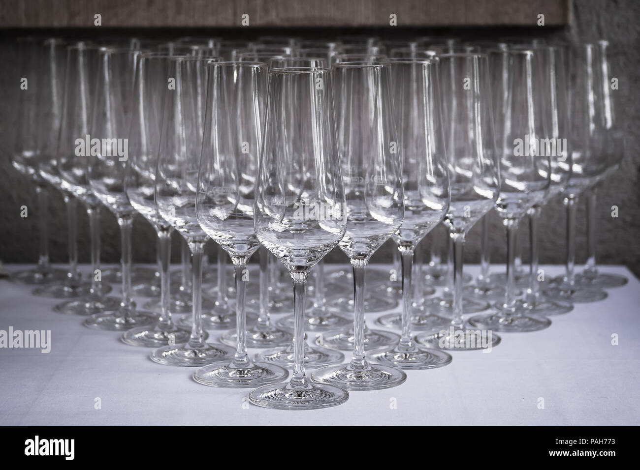 Champagne glasses ordered in triangular shape Stock Photo