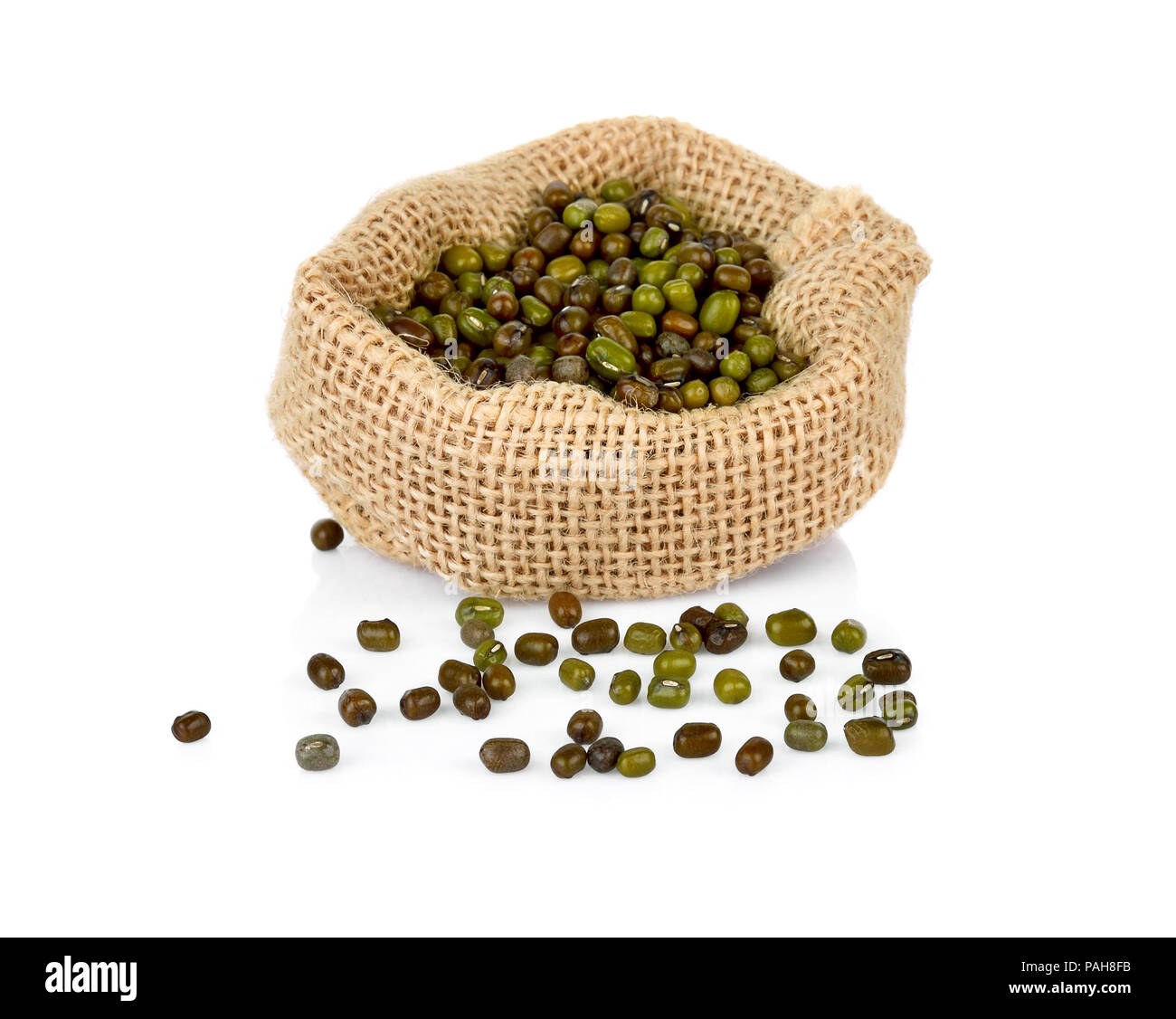 Mung beans (Vigna radiata) in bag on white background Stock Photo
