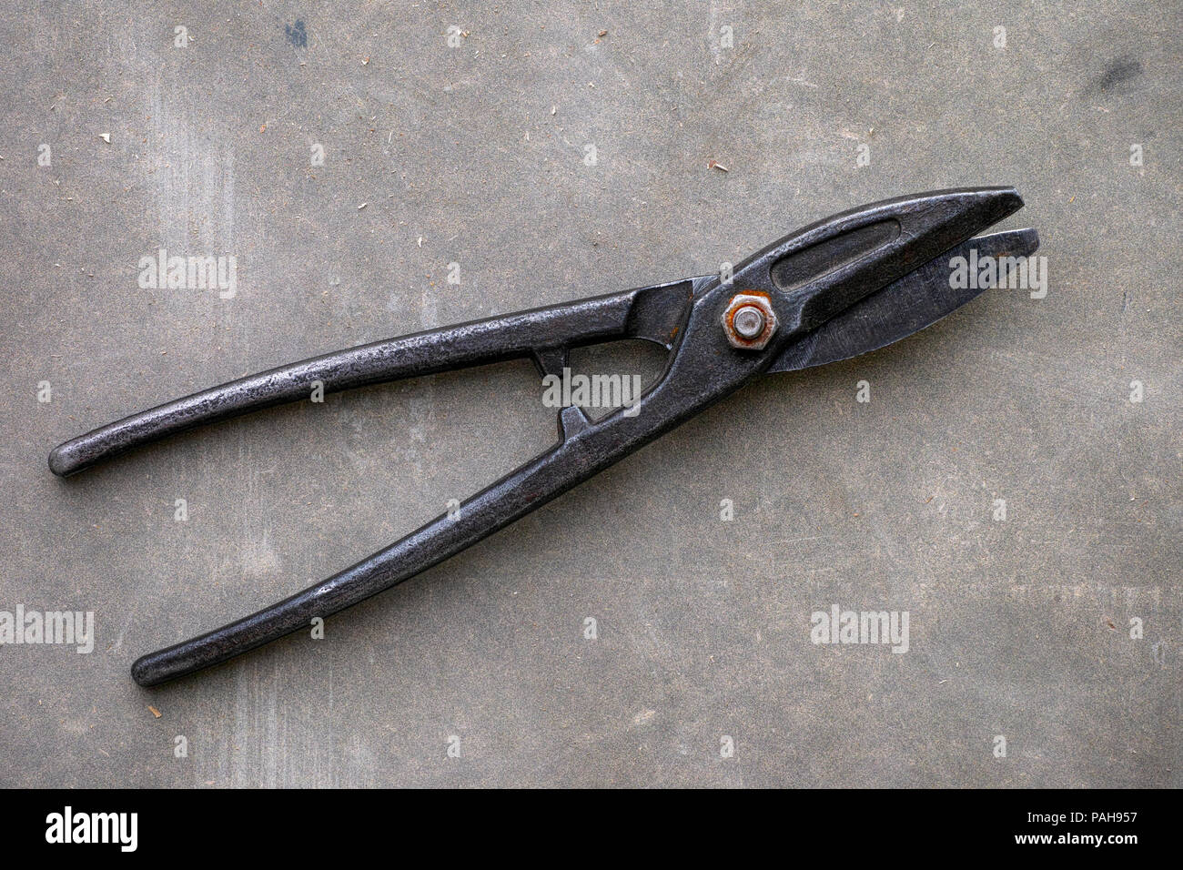 Metal Cutting Scissors on gray background. Close-up Stock Photo