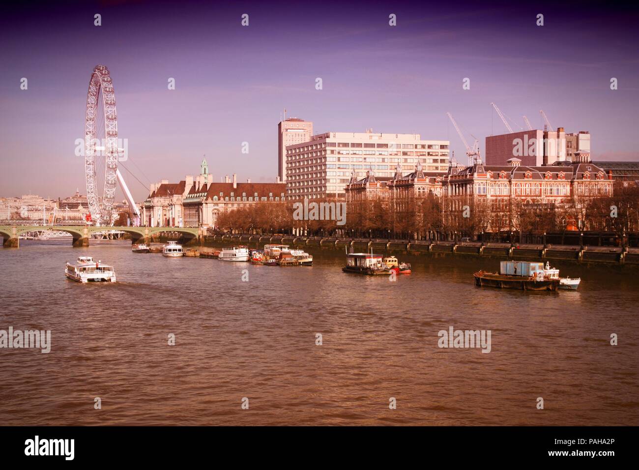London, England. Cityscape in January with Thames River. Cross processed color tone - retro filtered style. Stock Photo