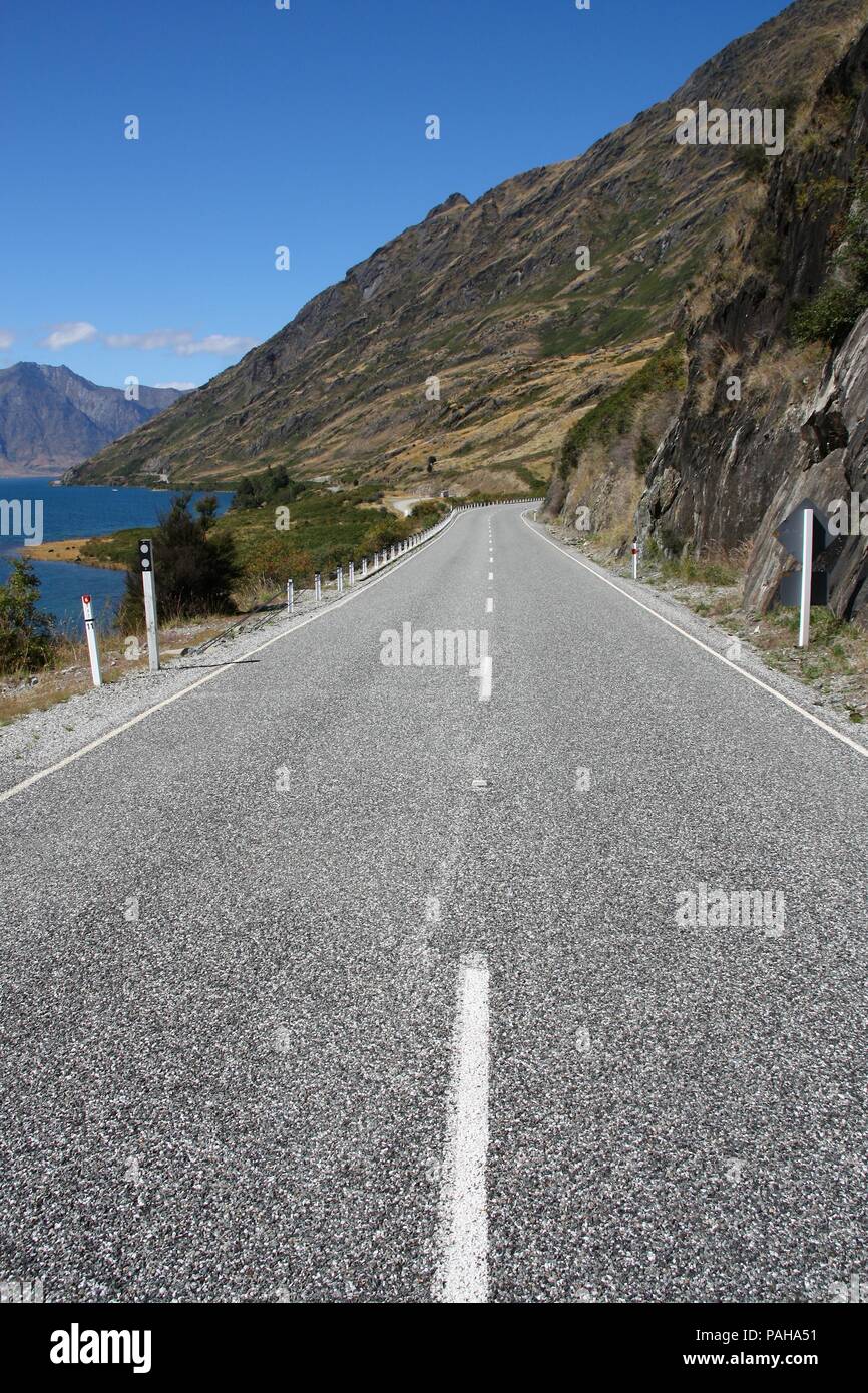 Road along Lake Hawea - beautiful landscape in Otago region, New Zealand Stock Photo