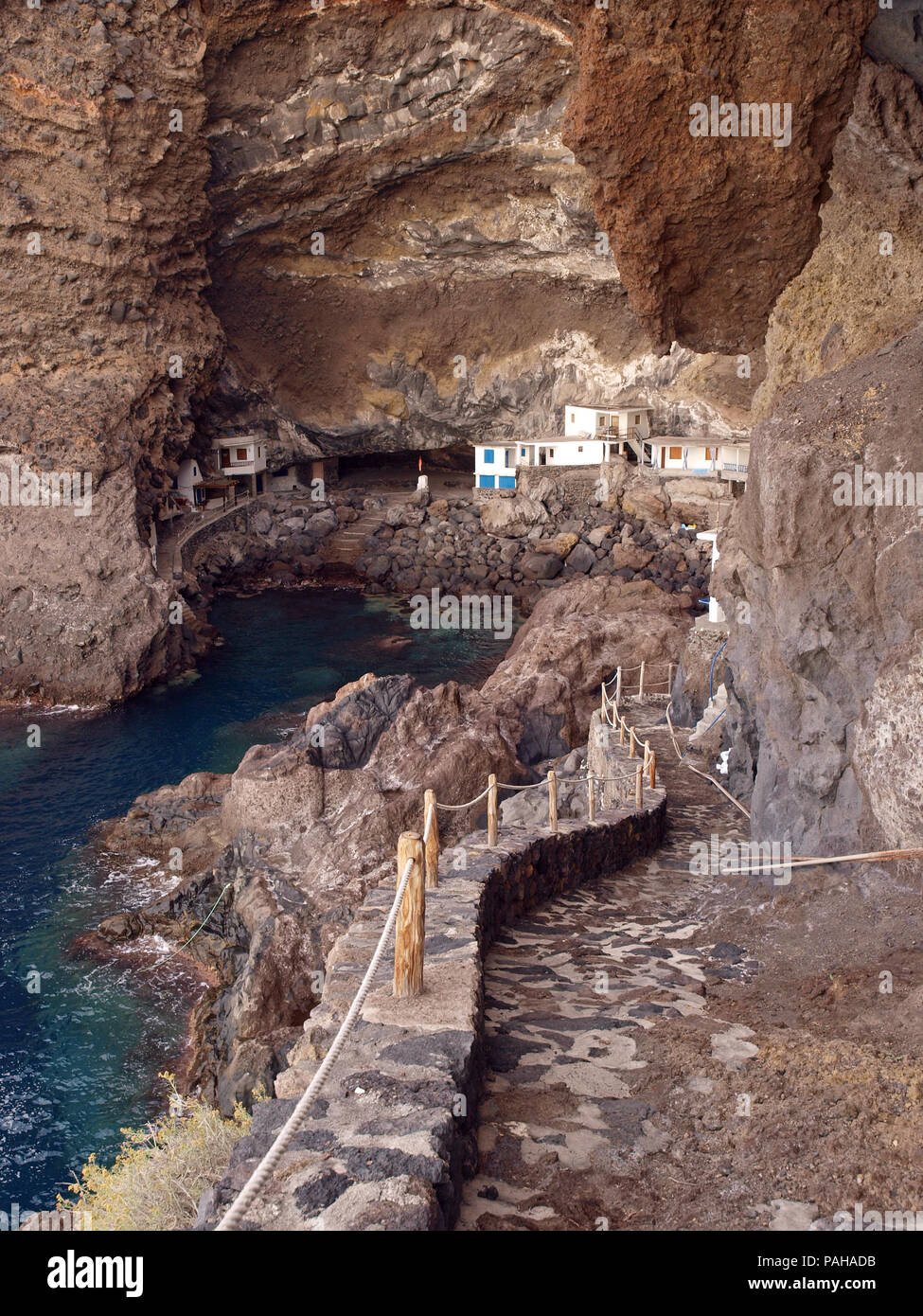 Prois de Candelaria , a collection of houses built into the base of overhanging cliffs on the Spanish Canary Island of La Palma Stock Photo