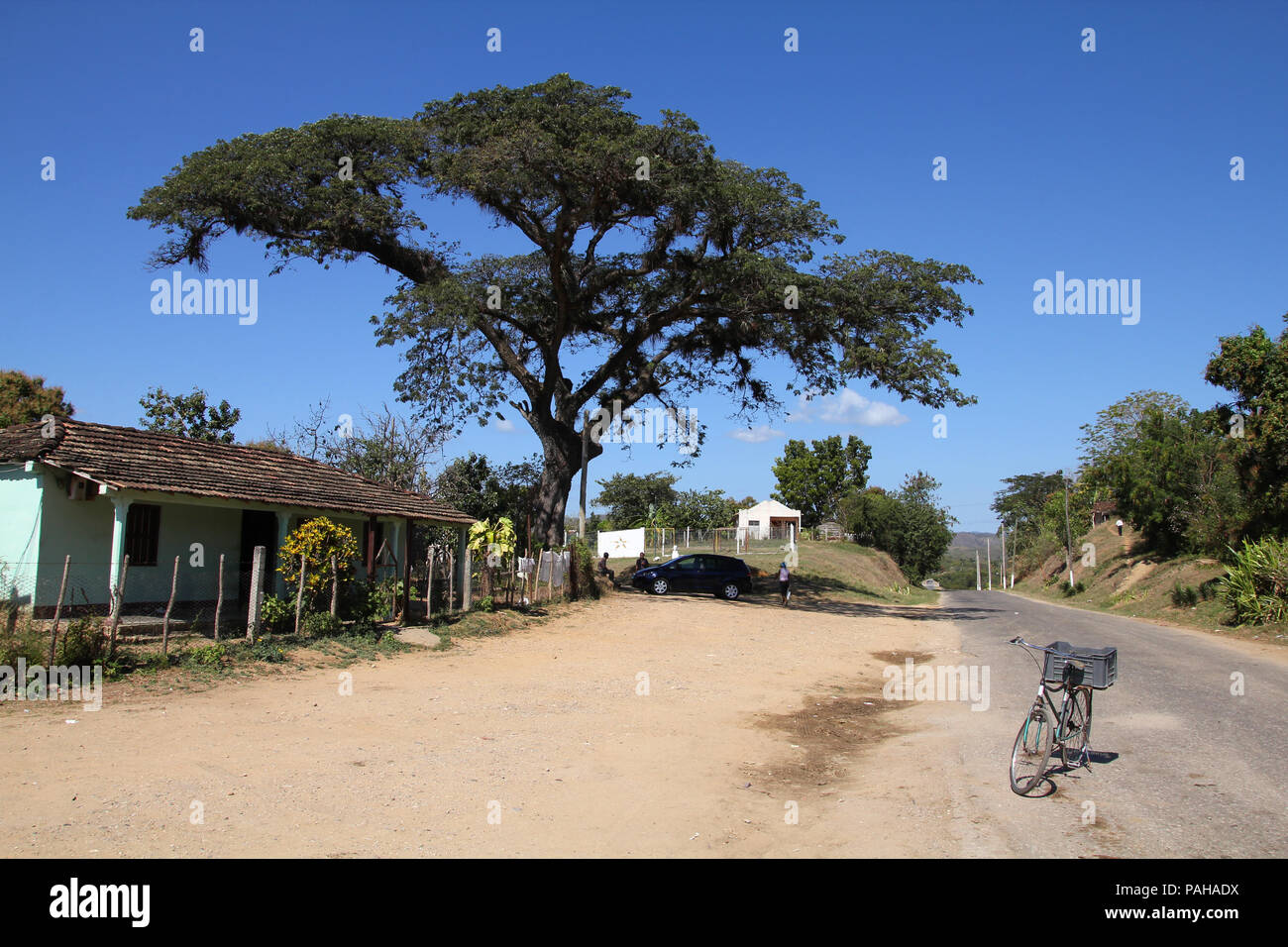 Cuba - typical village near Trinidad. Bicycle parked in the street. Stock Photo