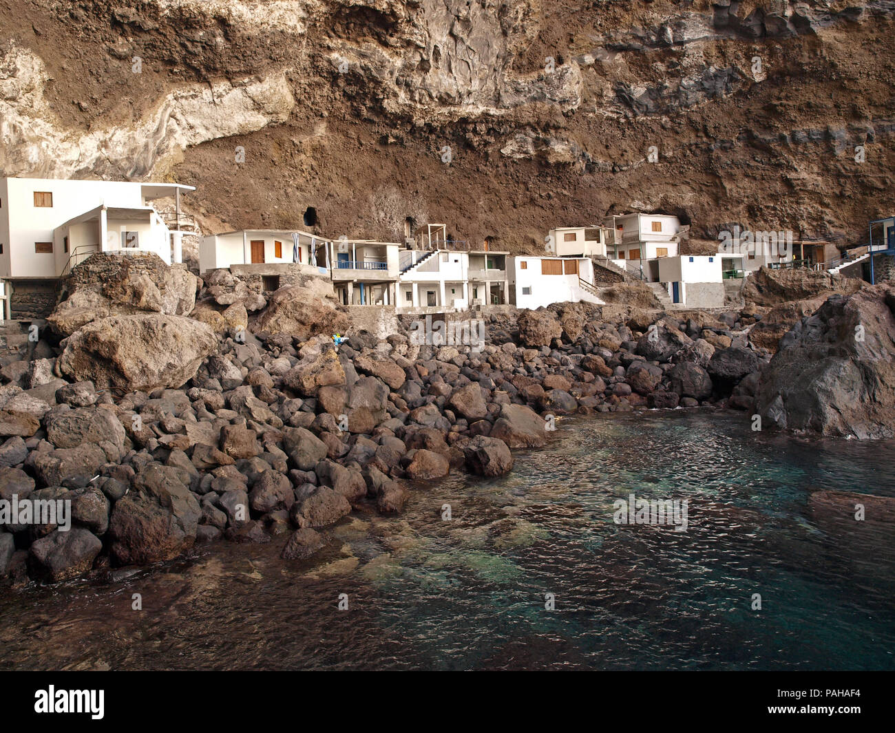 Prois de Candelaria , a collection of houses built into the base of overhanging cliffs on the Spanish Canary Island of La Palma Stock Photo
