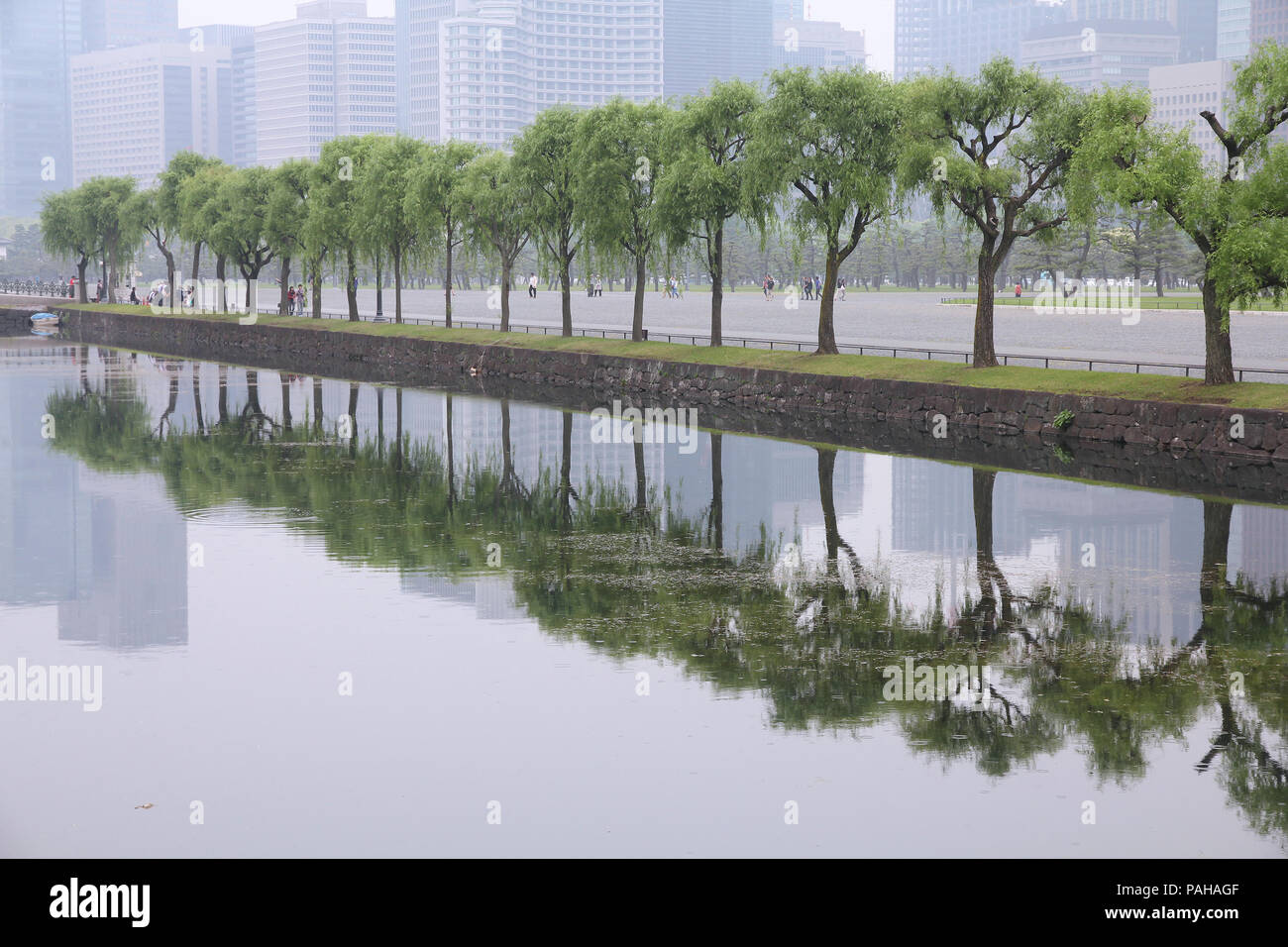 Tokyo, Japan - Imperial Palace gardens and the urban pollution smog. Stock Photo
