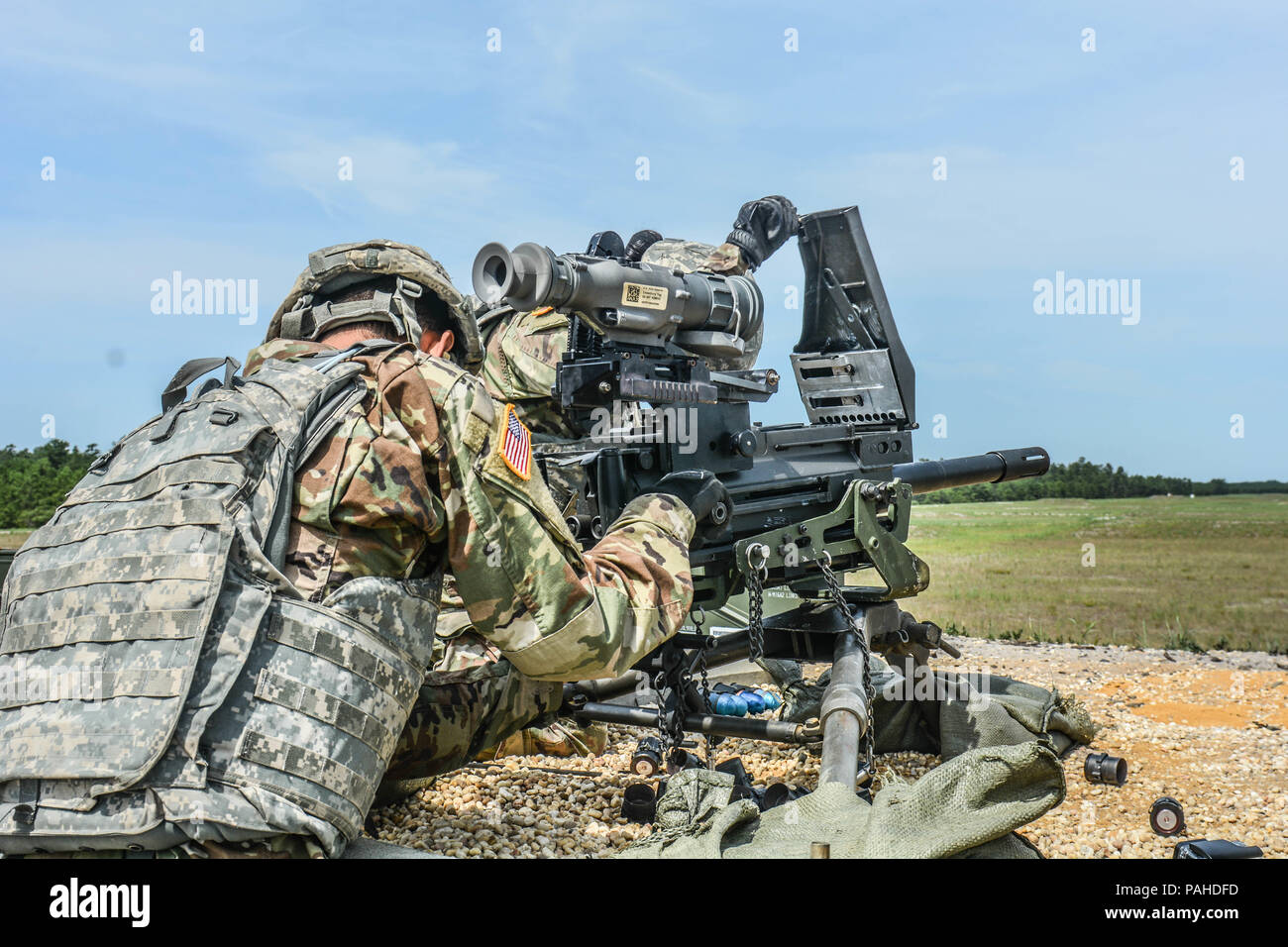 U.S. Army Reserve Troop List Unit Soldiers clear a Mark 19 40 mm grenade machine gun while qualifying during Operation Cold Steel II, hosted by U.S. Army Civil Affairs and Psychological Operations Command (Airborne), July 13, 2018 at Joint Base McGuire-Dix-Lakehurst, N.J. Operation Cold Steel is the U.S. Army Reserve's crew-served weapons qualification and validation exercise to ensure America's Army Reserve units and Soldiers are trained and ready to deploy on short notice as part of Ready Force X and bring combat-ready and lethal firepower in support of the Army and our joint partners anywhe Stock Photo