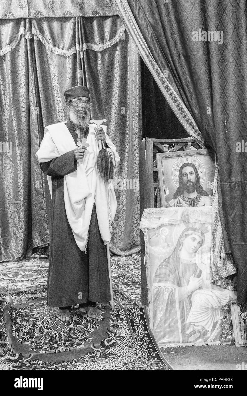 AKSUM, ETHIOPIA - SEPTEMBER 24, 2011: Unidentified Ethiopian priest. People in Ethiopia suffer of poverty due to the unstable situation Stock Photo