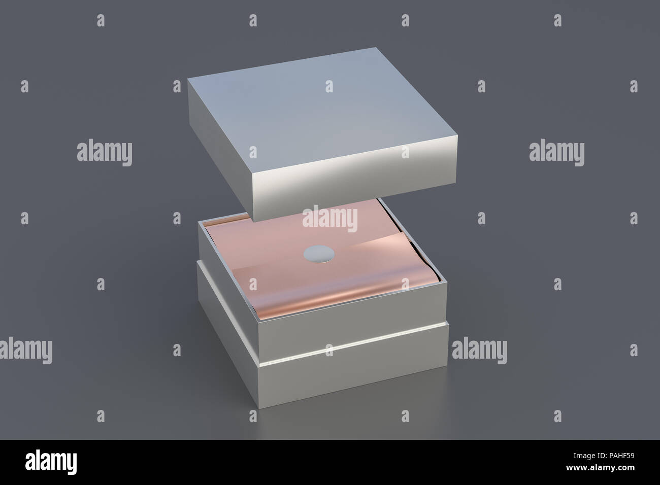 Opened silver square box with copper wrapping paper inside box and