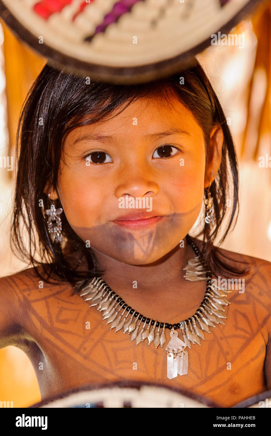 EMBERA VILLAGE, PANAMA, JANUARY 9, 2012: Portrait of an unidentified native Indian girl with bone bead and black paint on her face in Panama, Jan 9, 2 Stock Photo