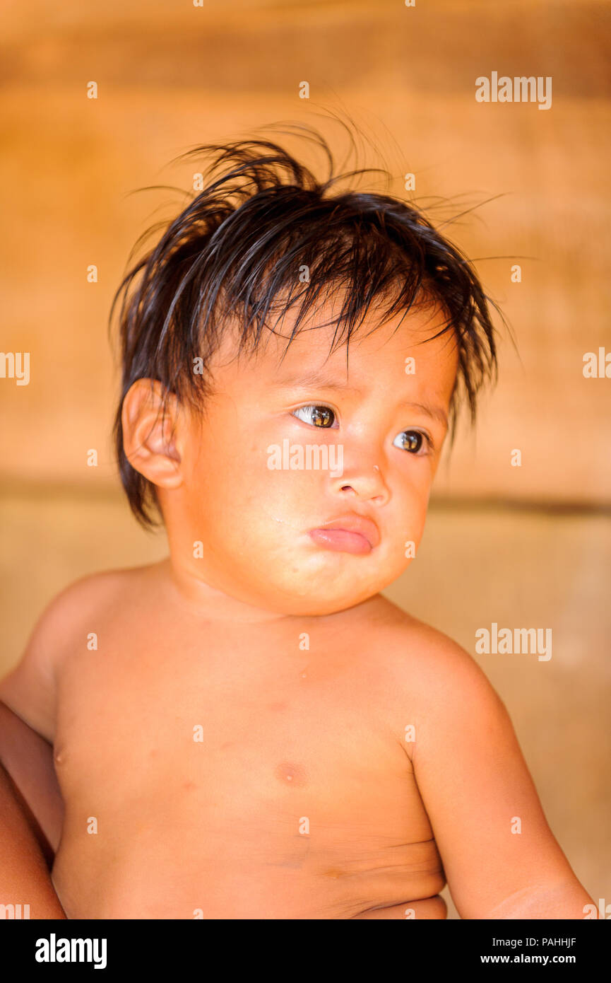 Smiling Indian Boy Baby Maracas Feather Foto de stock 95235967