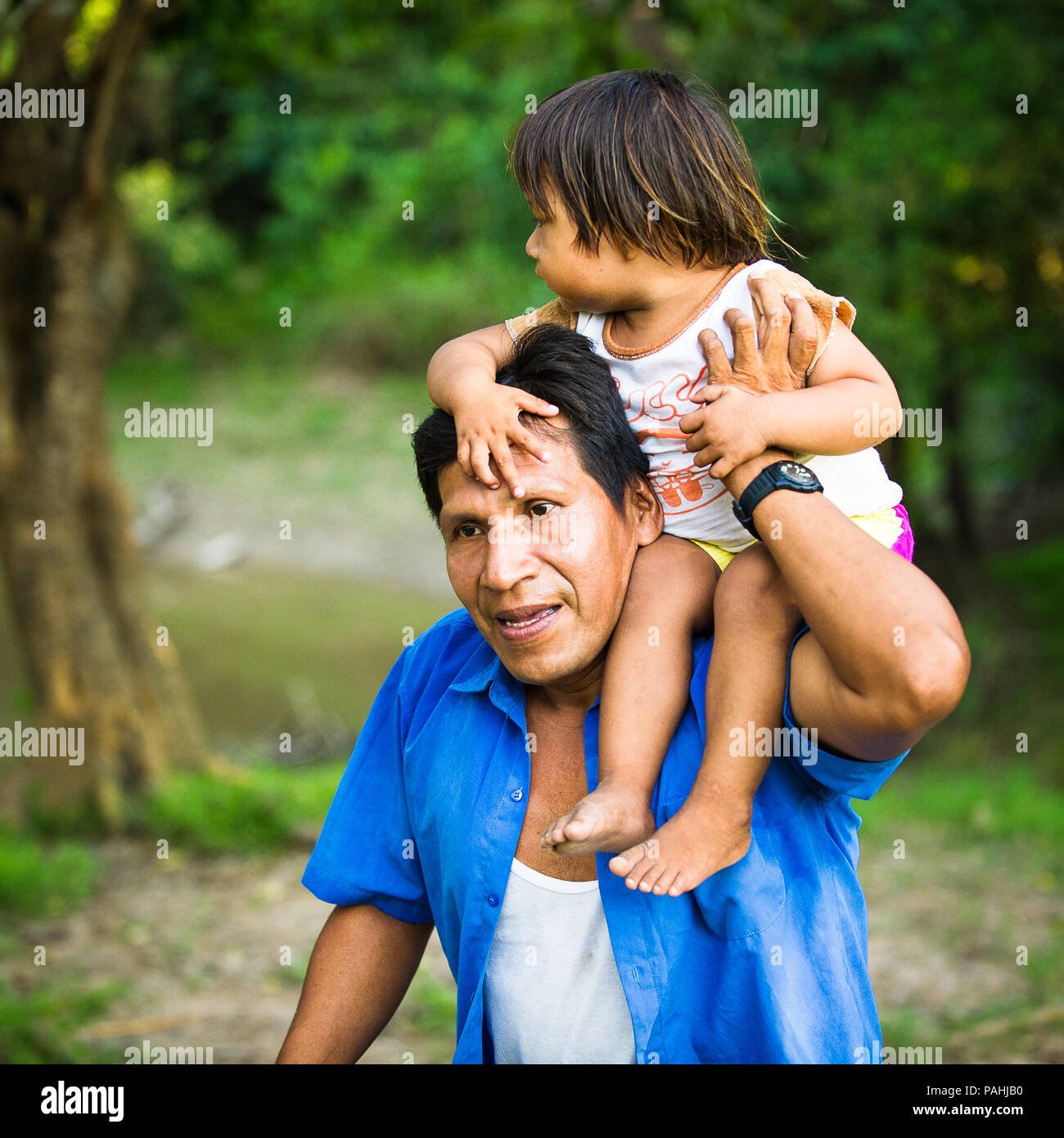 AMAZONIA, PERU NOV 10, 2010 Unidentified Amazonian man carries his