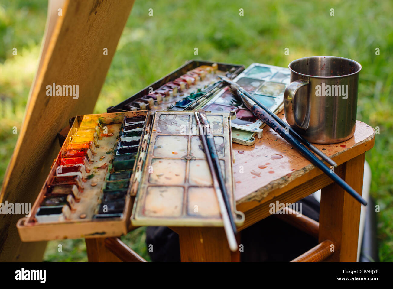 Water Color Pallet Brushes On Wooden Stock Photo 605094665