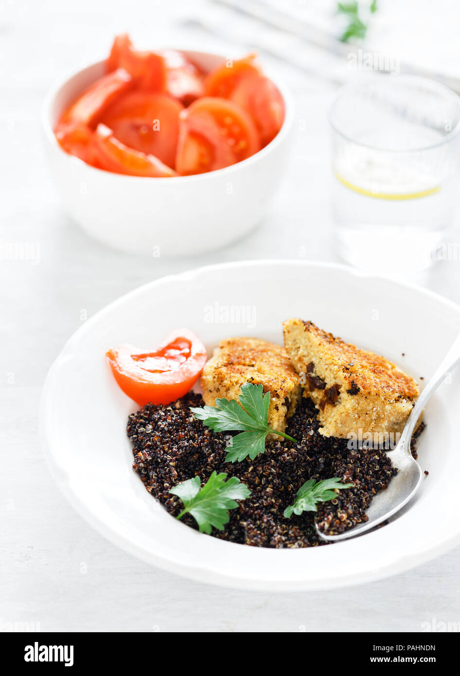 Oat prunes burgers with black quinoa on white background. Healthy balanced food Stock Photo