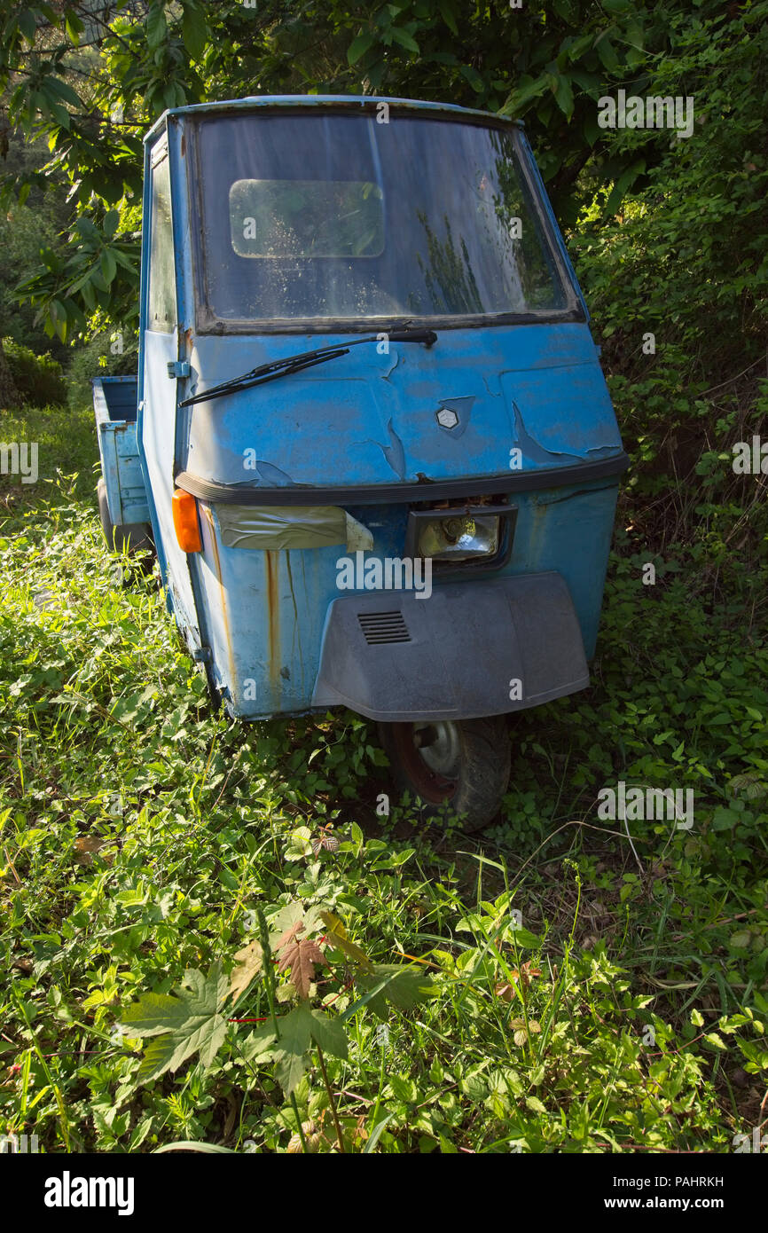 Front view of a Piaggio Elestart (Vespa) iconic Italian vehicle, now abandoned. Stock Photo