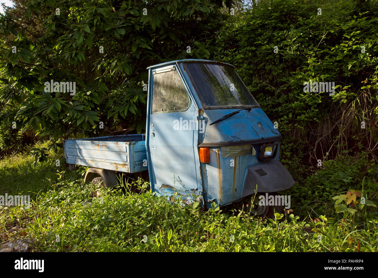 Profile of a Piaggio Elestart (Vespa) iconic Italian vehicle, now abandoned. Stock Photo