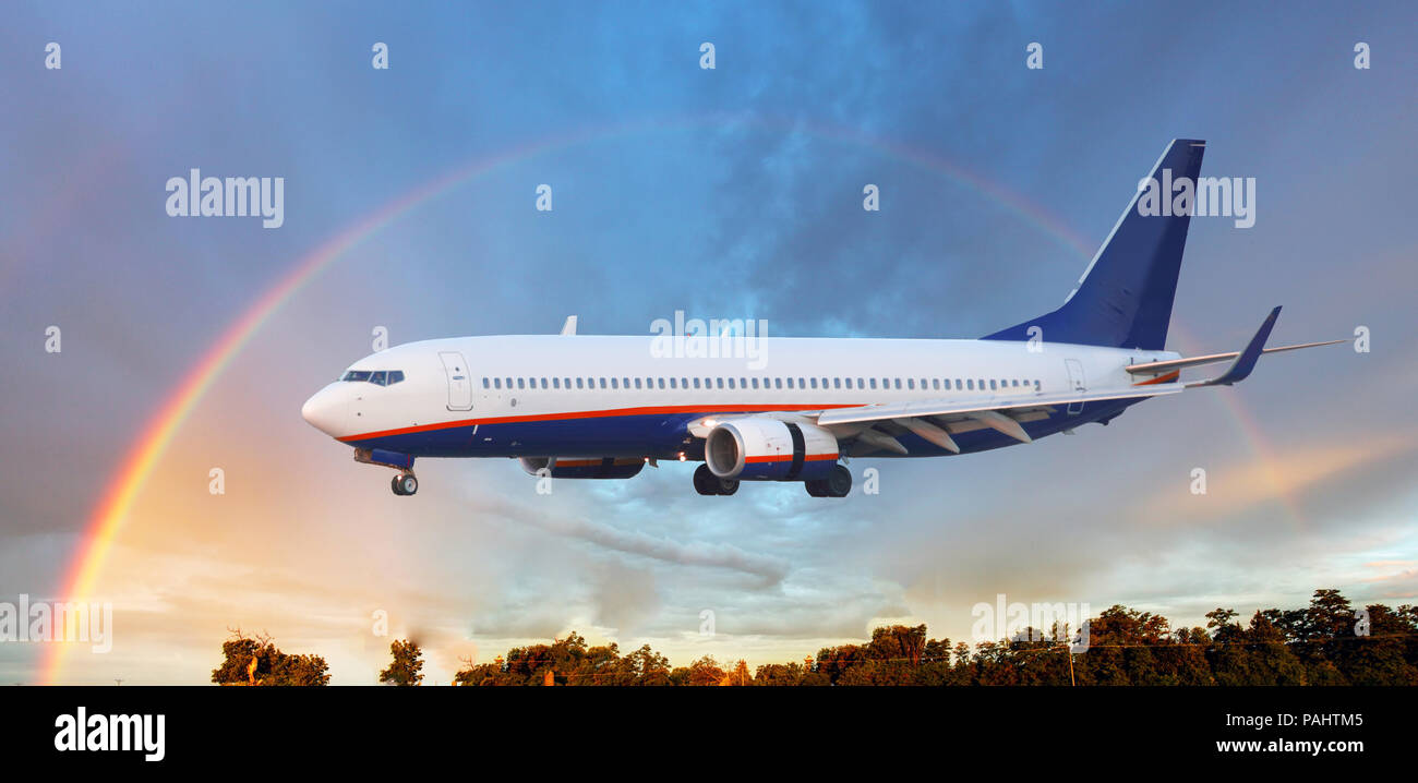 Landing airplane in Airport with rainbow Stock Photo - Alamy