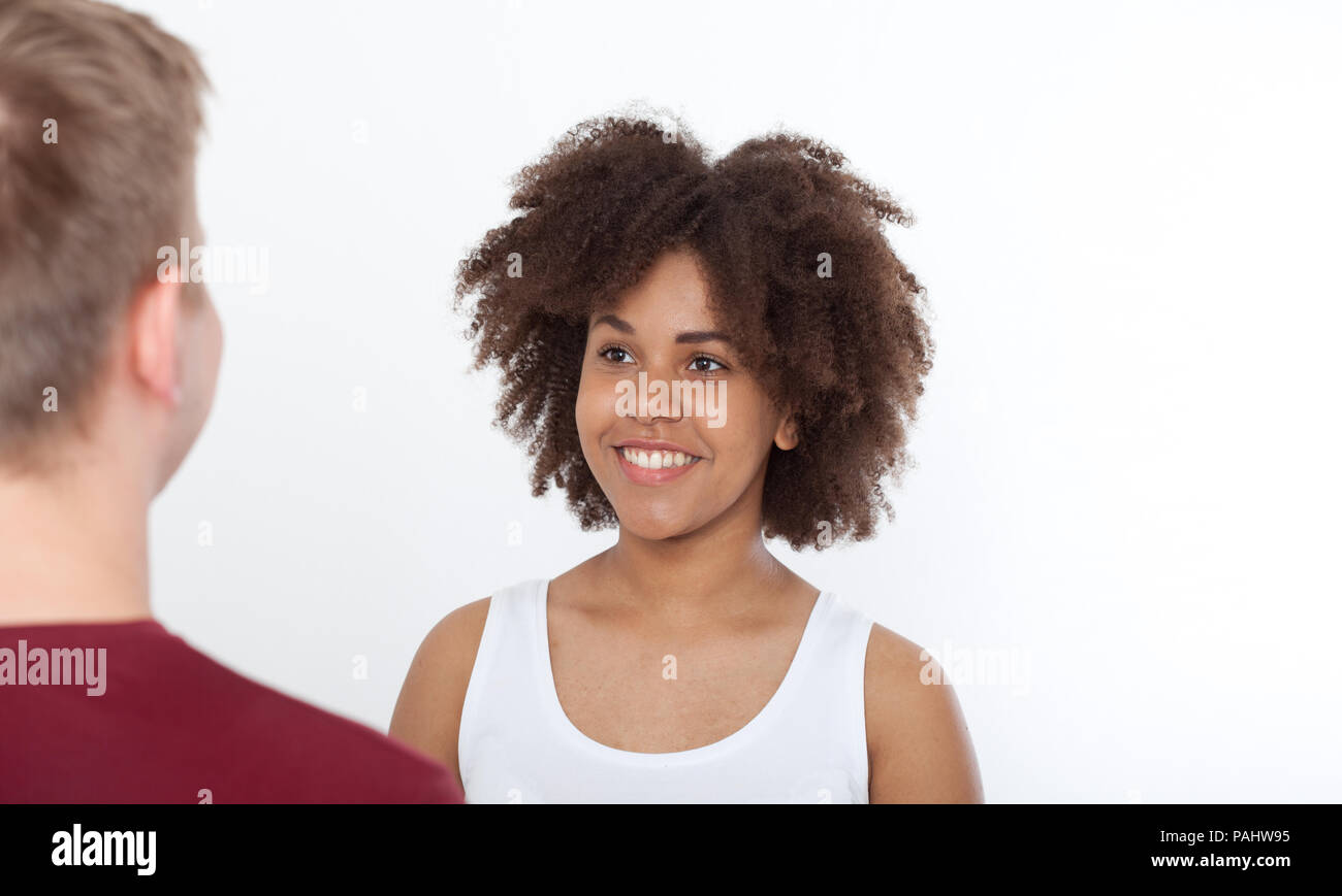 Happy Young couple of a mixed race looking at each other. Stock Photo