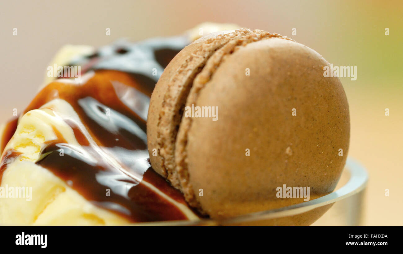 Summertime vanilla ice cream macro closeup with chocolate sauce ...