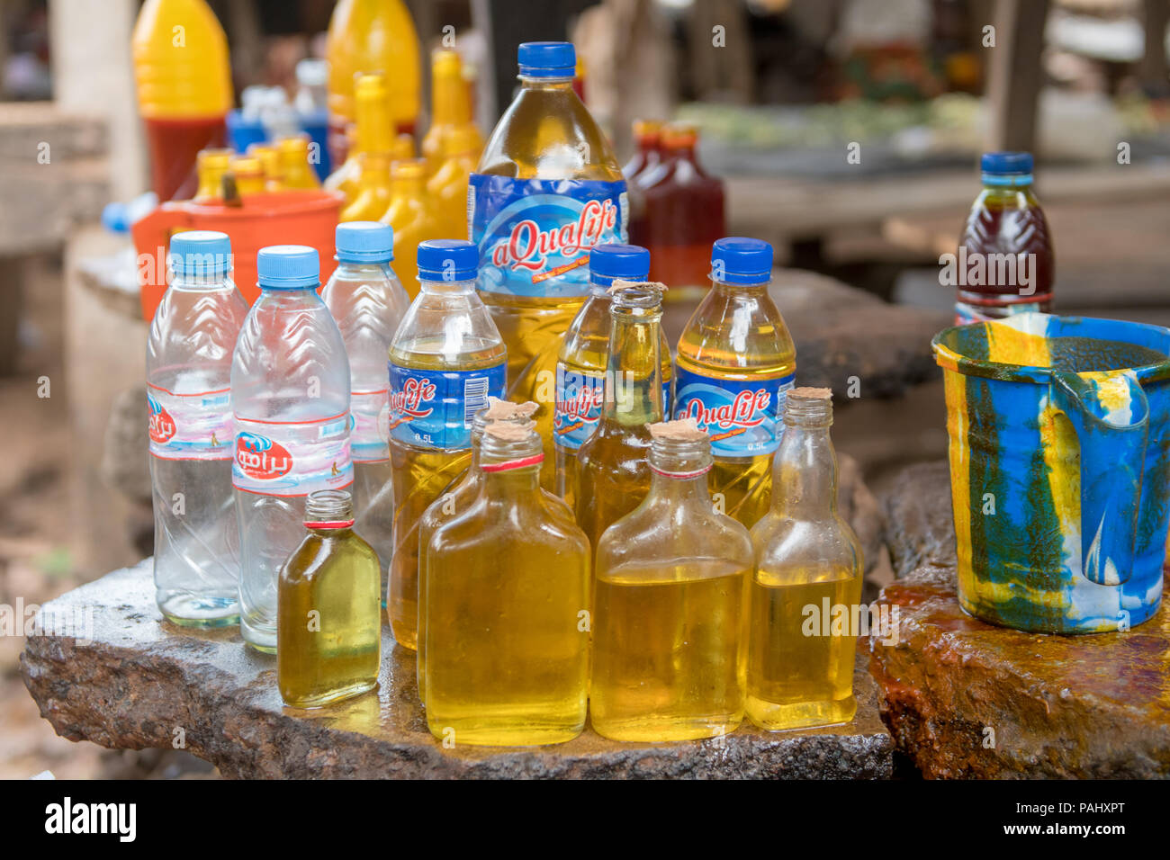 Bottles are full of Palm Oil (Elaeis guineensis) Ganta, Liberia Stock Photo