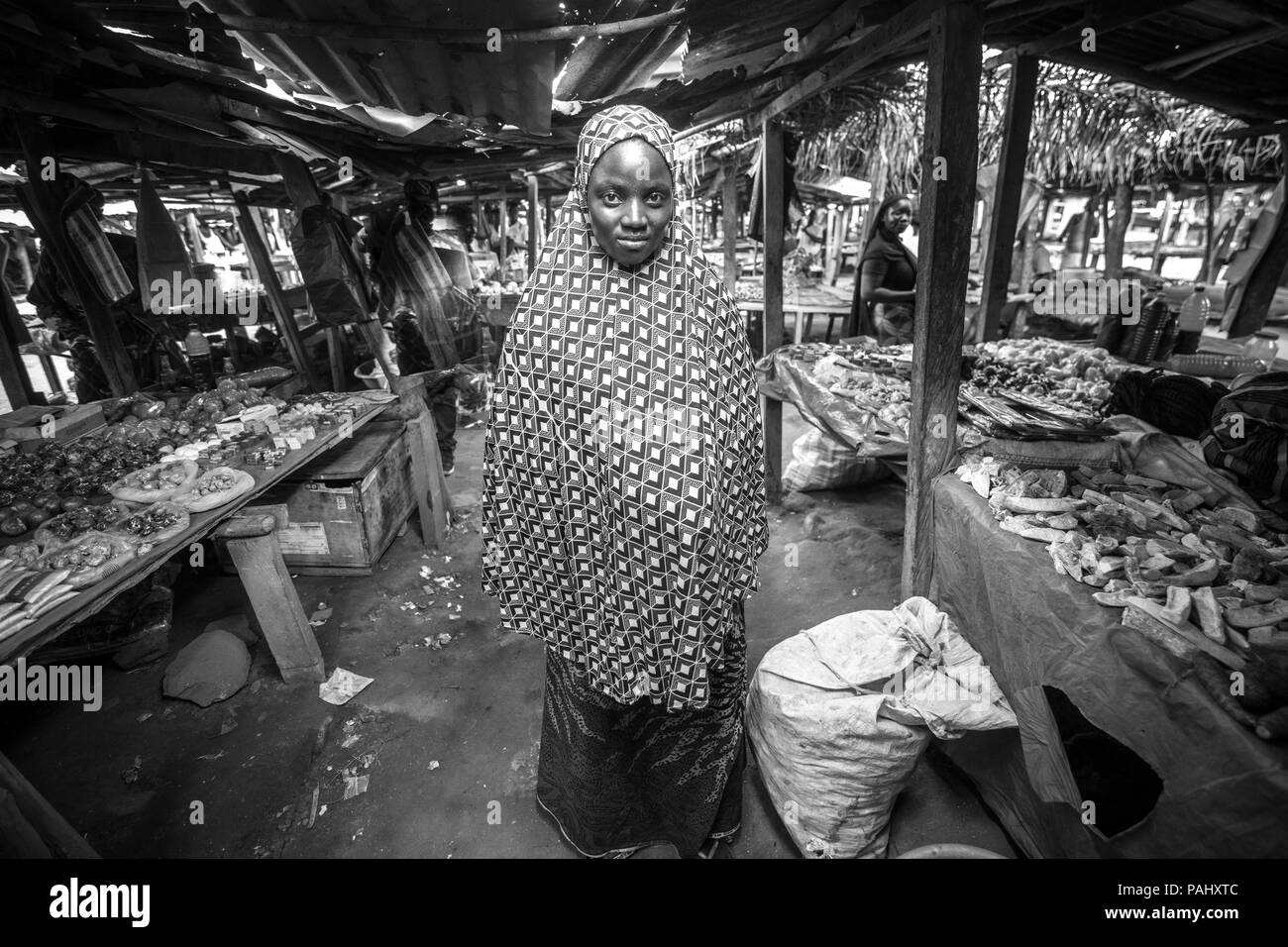A woman poses in the market in Ganta, Liberia Stock Photo