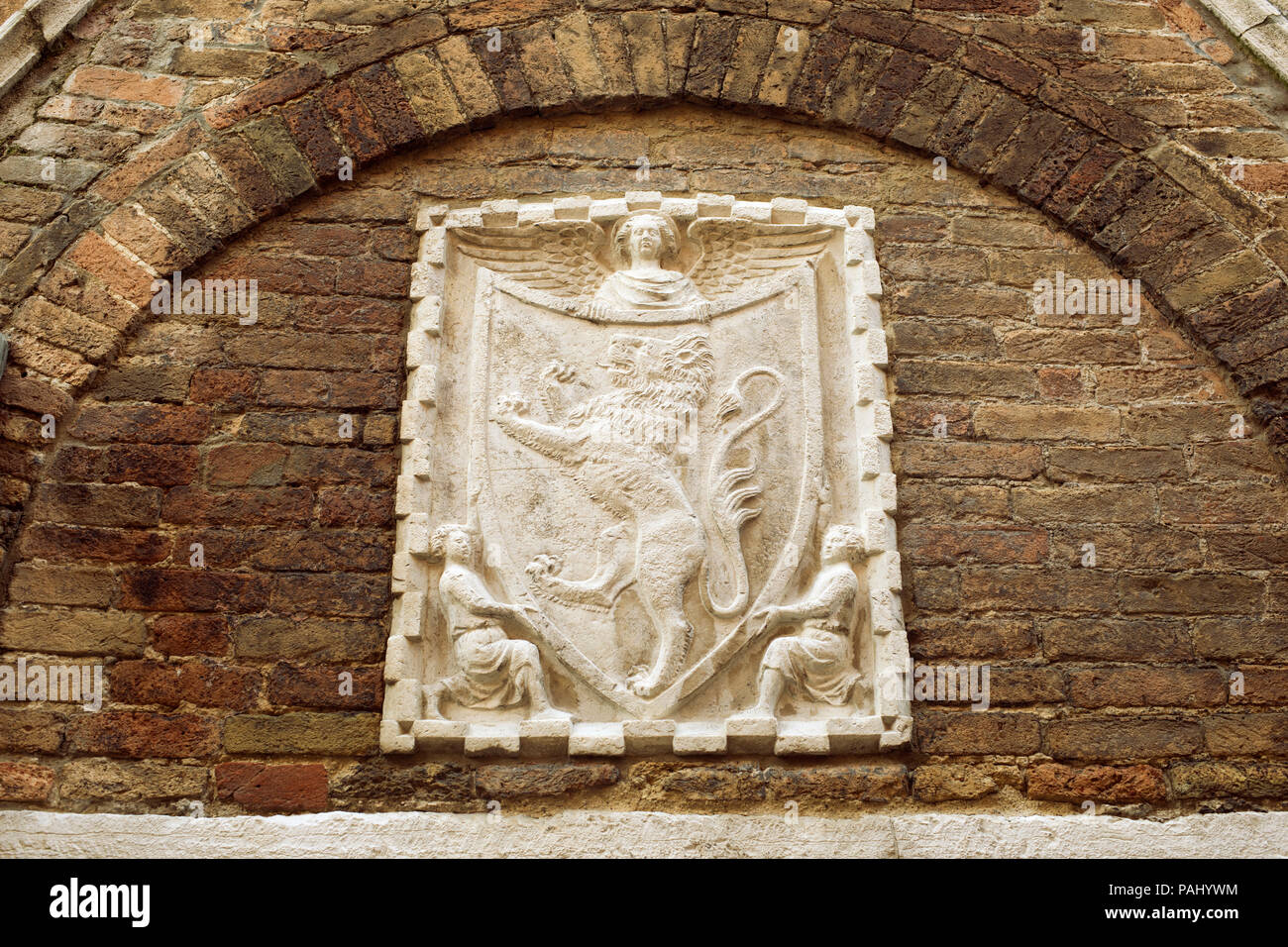 ancient wall fragment with Venetian coat of arms  relief from Venice, Italy Stock Photo