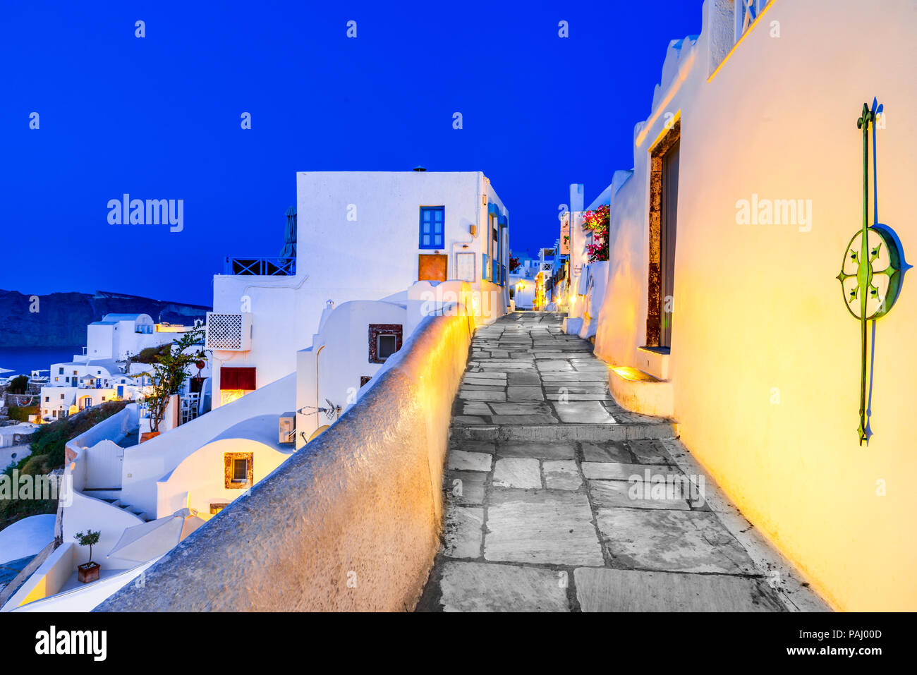 Santorini, Greece. Twilight amazing view of Oia, whitewashed city from Thira, Greek Islands. Europe holiday destination. Stock Photo