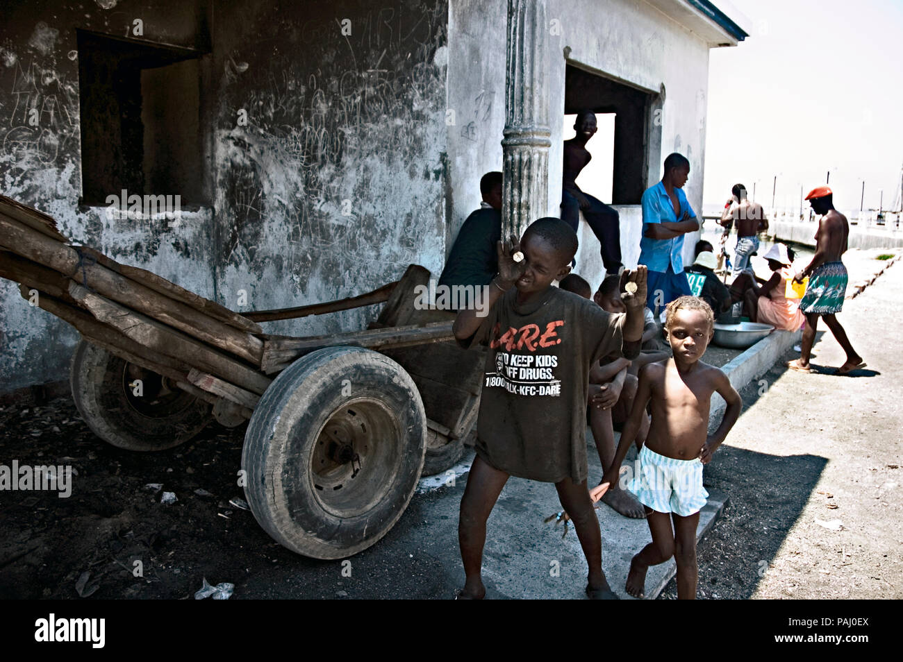 Kids hang out at the major port of Cite Soleil principally run by gangs.  Each gang has a district or territory Stock Photo - Alamy