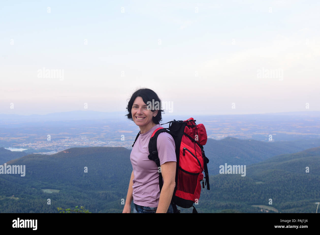 happy hiker woman to get to the top Stock Photo