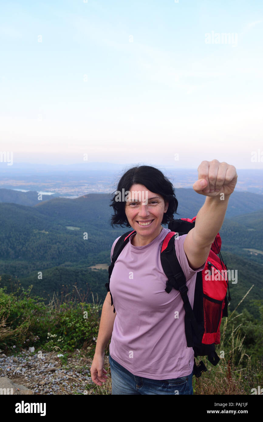 happy hiker woman to get to the top Stock Photo